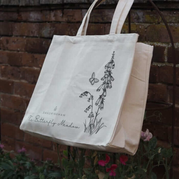 Bag with Sandringham in writing and a butterfly with some flowers